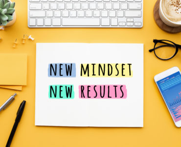 New mindset new results concepts with text on notepad on desk. positive thinking and motivation of business.