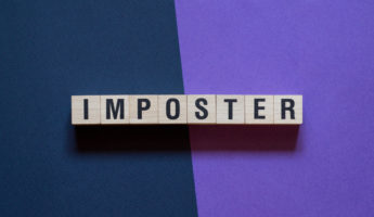 Imposter word concept on cubes.