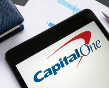 KYIV, UKRAINE - October 21, 2021. Capital One Financial Corporation logo and papers. Editorial.