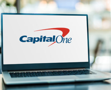 POZNAN, POL - JAN 6, 2021: Laptop computer displaying logo of Capital One Financial Corporation, a bank holding company specializing in credit cards, auto loans, banking, and savings accounts.