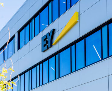 Waterloo, Ontario, Canada-September 30, 2019: Sign EY on the building in Waterloo, Ontario, Canada. Ernst & Young is a multinational accounting firms headquartered in London, England.