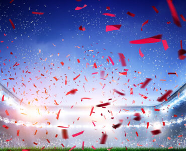 Soccer stadium background with flying confetti