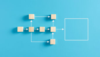 Business workflow and process automation flowchart. Wooden cube blocks representing work process management on blue background