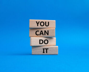 You can do it symbol. Concept words You can do it on wooden blocks. Beautiful blue background. Business and You can do it concept. Copy space.