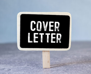 Notepad with the inscription COVER LETTER. Business letter text concept with cover letter text.