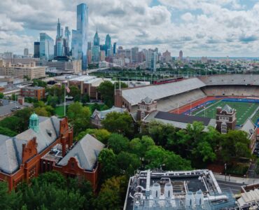 Stadium, buildings and the city skyline at the University of Pennsylvania, Philadelphia, Pennsylvania, United States.