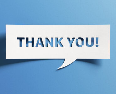 Thank you message for card, presentation, business. Expressing gratitude, acknowledgment and appreciation. Minimalist abstract design with white cut out paper on blue background.